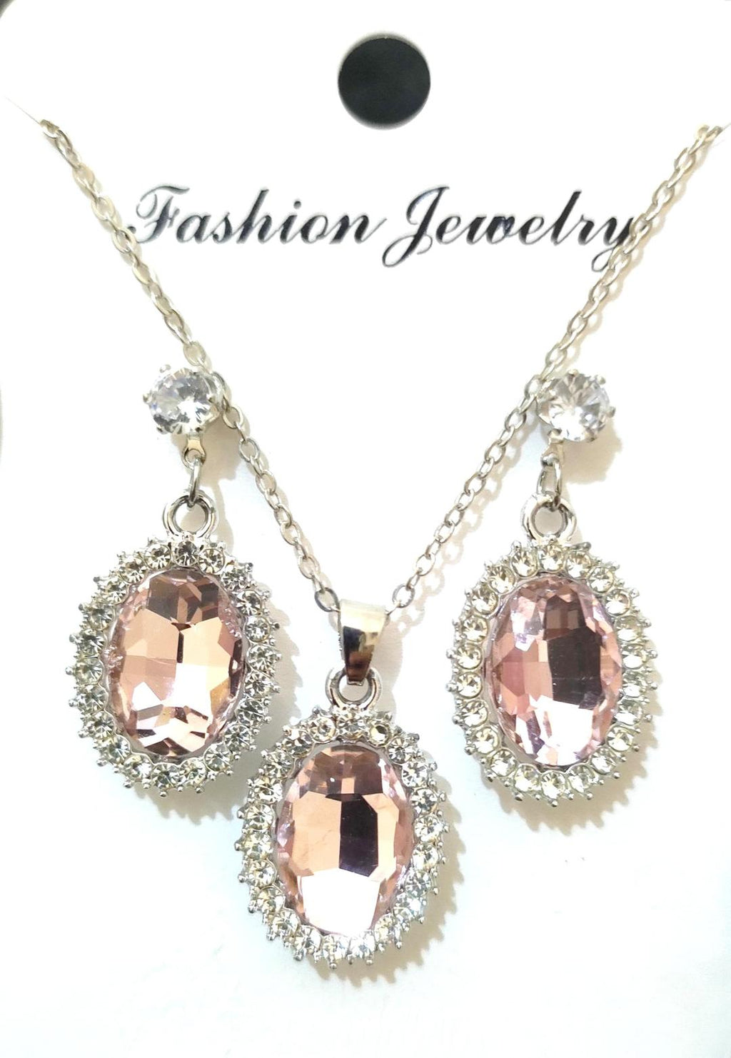 Jewelry set with rose gold pendant and matching earrings on a white background