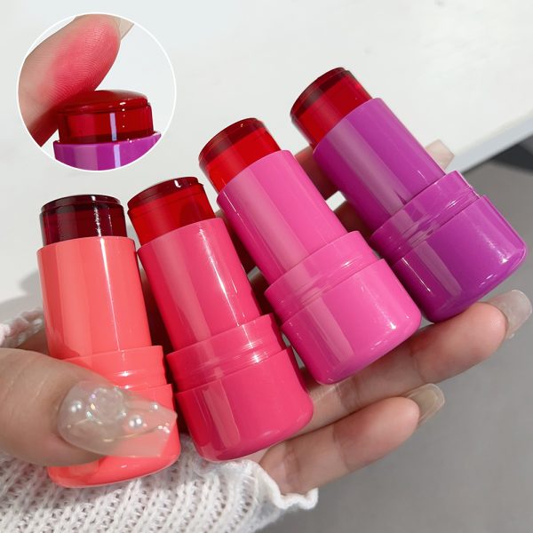 Four lip balm sticks in pink and purple held by a hand with a close-up of a pink lip balm.