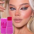 Close-up of a woman's face with makeup products, including a pink lip balm labeled 'Mila Forma'.