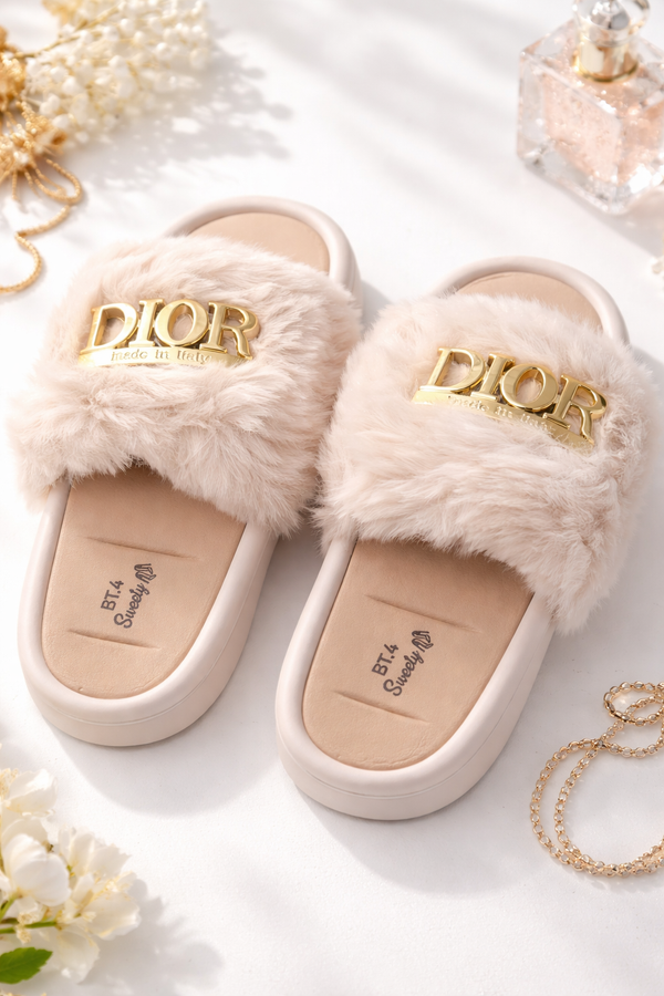 Fluffy Dior slippers with gold logo on a light background