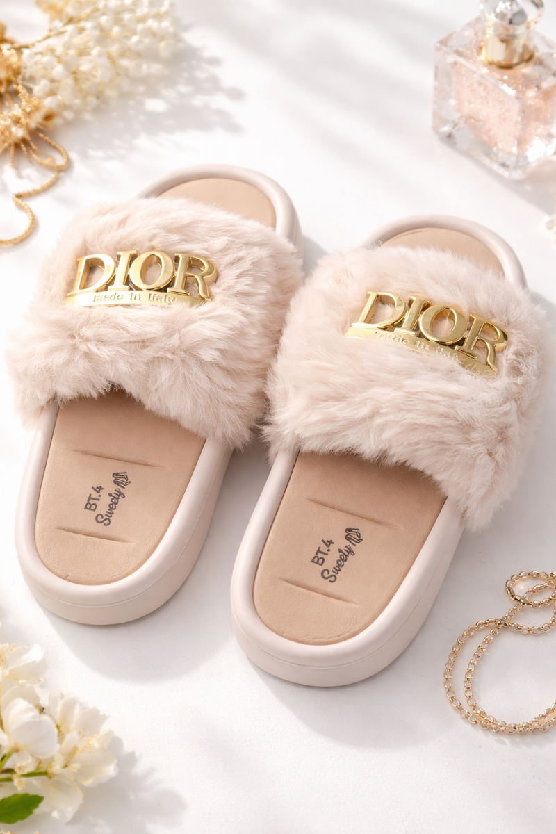 Fluffy Dior slippers with gold logo on a light background