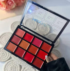 Makeup palette with various lip colors on a textured surface