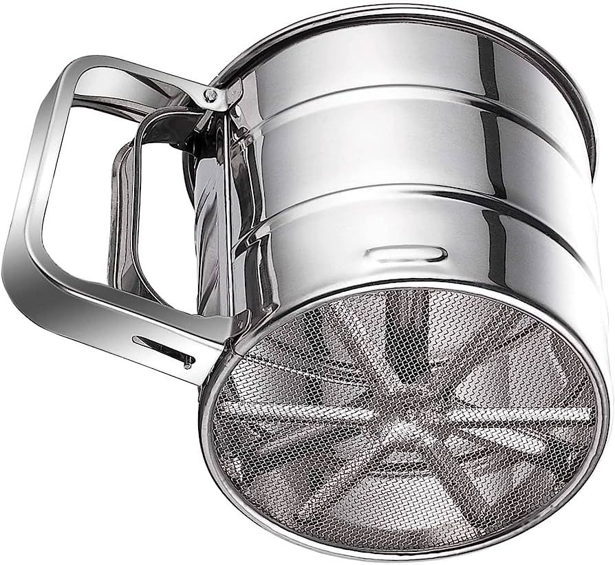 Metal flour sifter on a white background