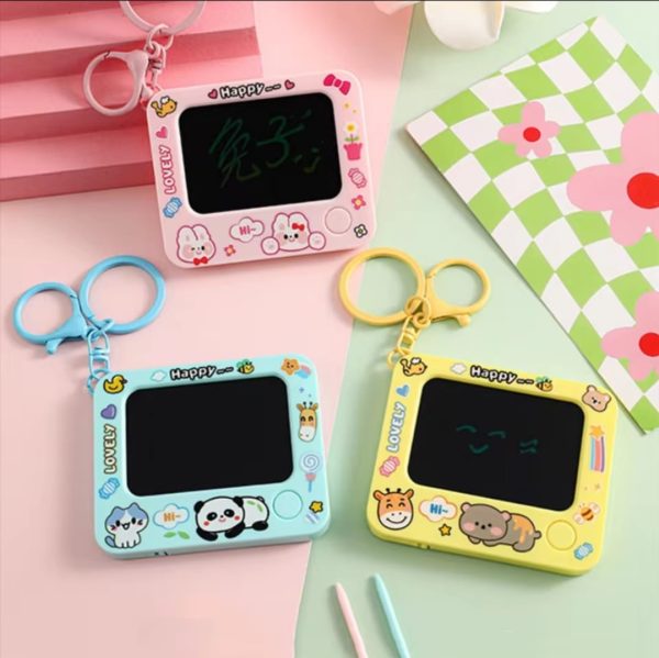 Three colorful electronic doodle boards with cartoon designs on a pink and green checkered background.