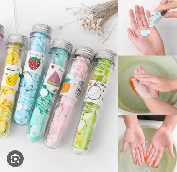 Colorful test tube-shaped containers with cartoon labels on a white background, next to images of hands washing with soap.