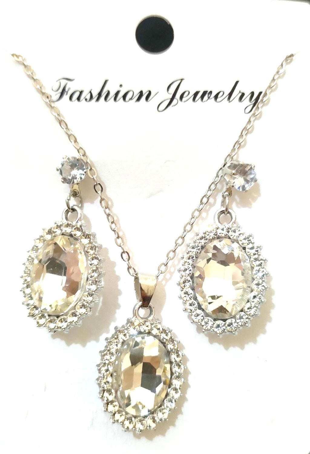 Jewelry set with necklace and earrings featuring large crystals on a white background.