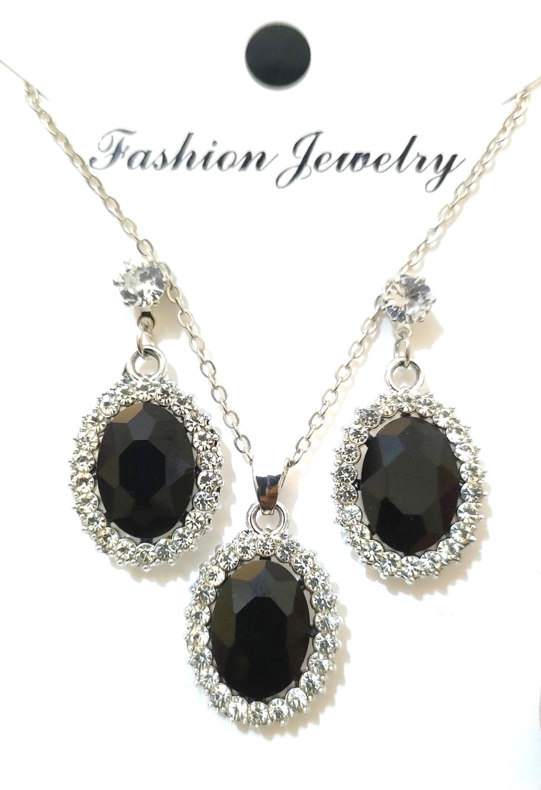 Black gemstone necklace and earrings on a white background with 'Fashion Jewelry' text.
