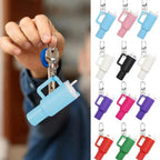 Blue keychain with a holder and colorful keychain holders on a blurred background