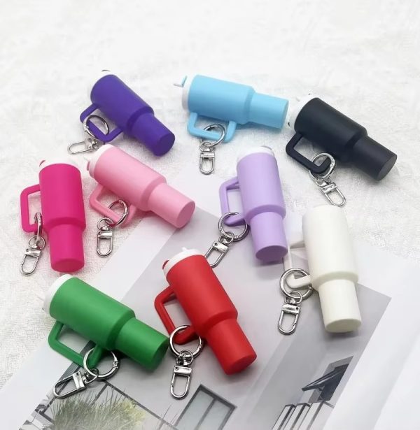 Colorful keychain whistles on a white background