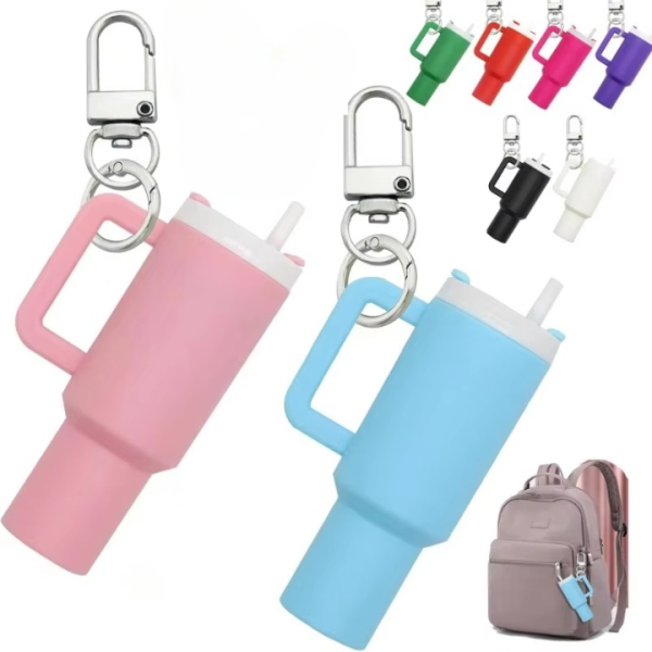 Pink and blue keychain holders with carabiners on a white background