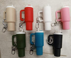Set of colorful keychain holders with different colors on a neutral background