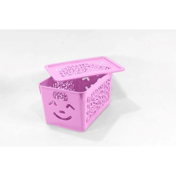 Pink storage basket with a smiley face design on a white background