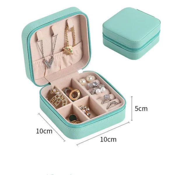 Teal jewelry box with jewelry inside, dimensions indicated