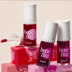 Benefit benetint lip tint bottles with applicator on a beige background
