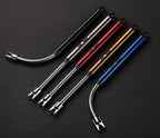 Set of five metal tools with flexible ends on a black background