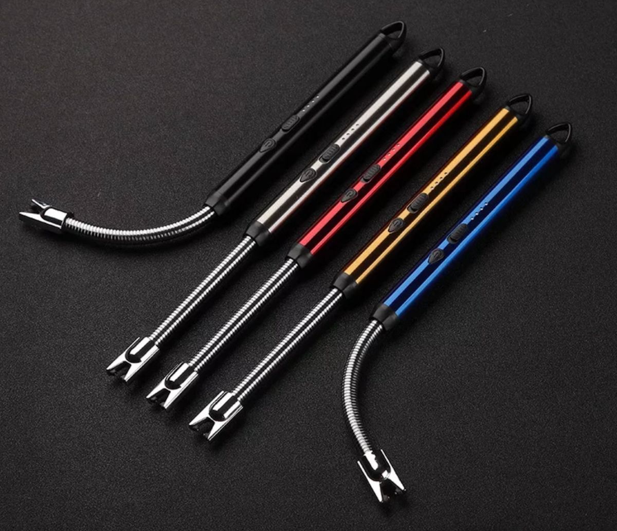Set of five metal tools with flexible ends on a black background