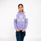 Child wearing a purple and white hoodie with 'Stay Wild' text on a white background