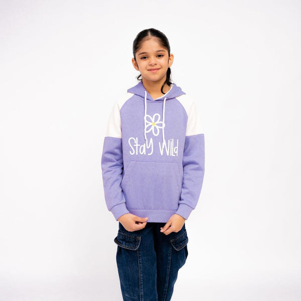 Child wearing a purple and white hoodie with 'Stay Wild' text on a white background