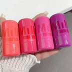 Four lip balm tubes with 'MIU FORMBO' branding held in a hand.
