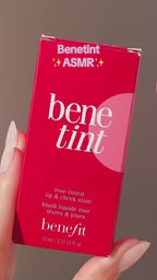 Benetint lip and cheek tint bottle in classic red shade, perfect for a natural rosy glow and long-lasting color.